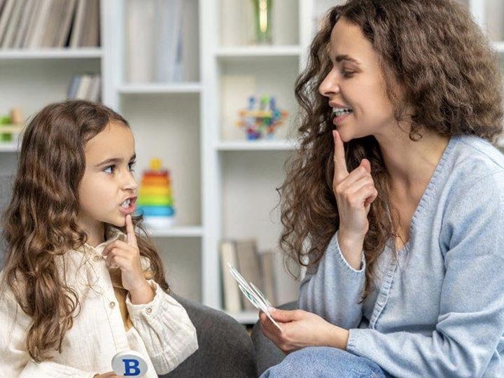 A speech therapist works with a child in Le Mars, Iowa
