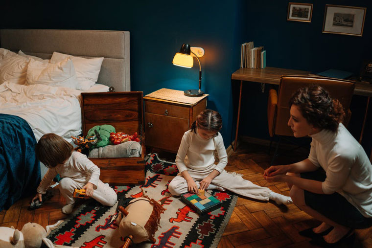 A Woman Babysitting 2 Kids in a Cozy Bedroom in Le Mars, Ia