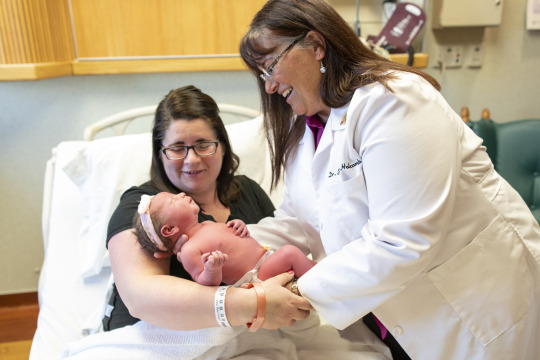 OB Handing baby to mother