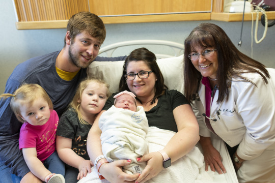 Family meeting a baby