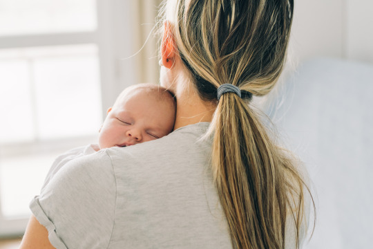 Mother holding infant child