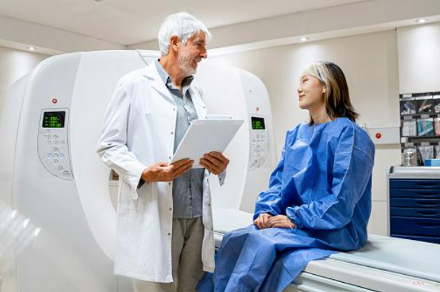 A radiologist talking to a patient